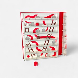 May include: A white ceramic mug with a black handle and the text "But First, Coffee" in a black, bold font. The mug is sitting on a wooden surface. The mug is 4 inches tall.