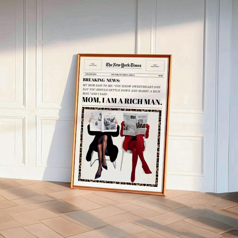 May include: A framed print of a newspaper article with the headline "BREAKING NEWS: MOM, I AM A RICH MAN." The article features a photo of two women sitting in chairs, reading newspapers. The women are wearing black and red outfits and are sitting in front of a leopard print background.