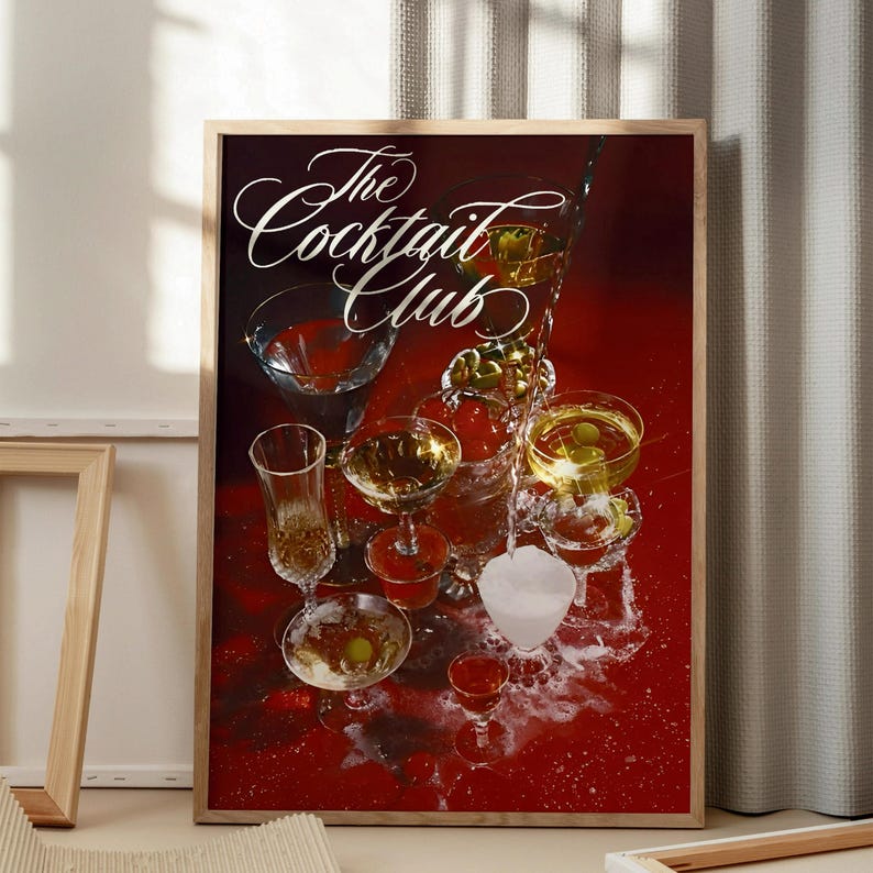 May include: A vintage poster with the text "The Cocktail Club" in a white cursive font on a red background. The poster features a collection of martini glasses filled with various cocktails and garnishes, including olives and cherries.