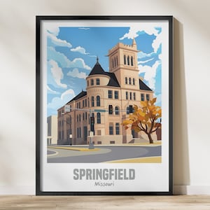 Puede incluir: Una impresión enmarcada con una ilustración estilizada de un edificio en Springfield, Missouri. La obra de arte representa un edificio beige con una torre, sobre un cielo azul con nubes. La palabra "SPRINGFIELD" está impresa en la parte inferior.