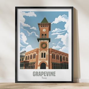 May include: A framed art print featuring a stylized illustration of the Grapevine, Texas clock tower building. The brick-colored structure has a green roof, a clock face, and a holiday wreath. The text GRAPEVINE Texas is printed at the bottom.
