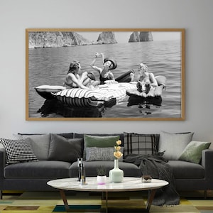 Vintage Floating Luncheon, Three young women eat spaghetti on inflatable mattresses at Lake of Capri 1939, Eating Spaghetti