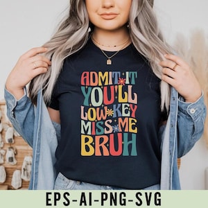 May include: A navy blue t-shirt featuring the phrase "ADMIT IT YOU'LL LOW KEY MISS ME BRUH" in a retro, colourful font. This casual top is a statement piece, suitable for everyday wear and expressing a lighthearted message.