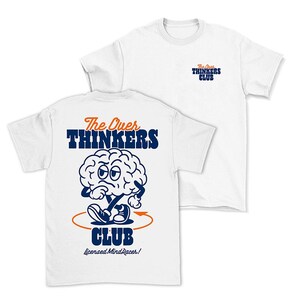 May include: White t-shirt with a blue and orange graphic of a cartoon brain with the text "The Over Thinkers Club" and "Licensed Mind Racer!"