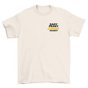 May include: A white t-shirt with the text "Easy Peasy Lemon Squeezy" printed in black and yellow.
