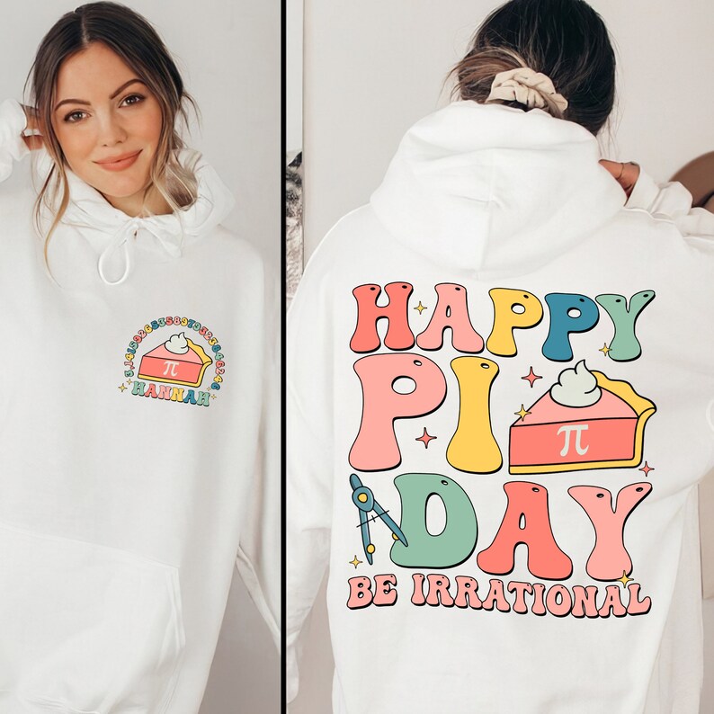 May include: White hoodie with a colorful graphic design that says "Happy Pi Day Be Irrational" with a pie slice featuring the mathematical symbol for pi.