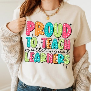 May include: A white t-shirt with the text "PROUD TO TEACH multilingual LEARNERS" in colorful letters with white polka dots.