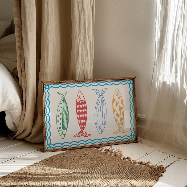 May include: A framed print of four colorful fish with a blue wave border. The fish are red, green, blue, and yellow with white outlines.
