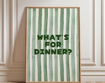 May include: A framed print with a watercolor design of vertical green and white stripes. The text "WHAT'S FOR DINNER?" is in bold green letters in the center of the print. The frame is a light brown color.