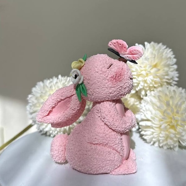 Adorable pink bunny Fondant cake topper with flowers and butterfly