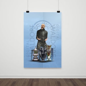 May include: A man in a black jacket and blue jeans stands in front of a blue background with the text "DIGITAL WALDORE" and "DIGITAL WALDORE" in a circle. He is holding up four trophies, including the Premier League trophy, the FA Cup, and the EFL Cup.