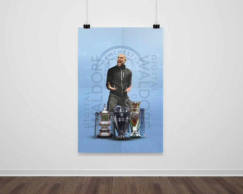 May include: A man in a black jacket and blue jeans stands in front of a blue background with the text "DIGITAL WALDORE" and "DIGITAL WALDORE" in a circle. He is holding up four trophies, including the Premier League trophy, the FA Cup, and the EFL Cup.