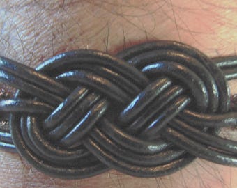 Celtic Knotted Leather Bracelet for men or women with easy to use metal clasps.