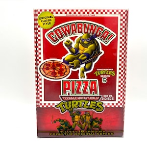 May include: A red DVD box with a Teenage Mutant Ninja Turtles pizza theme. The box features a cartoon image of a turtle holding a pizza with the words "Cowabunga!" and "Pizza" in large, bold letters. The box also includes the text "Teenage Mutant Ninja Turtles Season 5" and "Includes 18 episodes from the original series."
