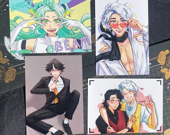 May include: Four art prints with anime-style illustrations. One print has the text "LUCKY LUCKY" and "BEAM". The other prints depict male figures in various poses, with one wearing heart-shaped sunglasses. The prints are on a dark background.