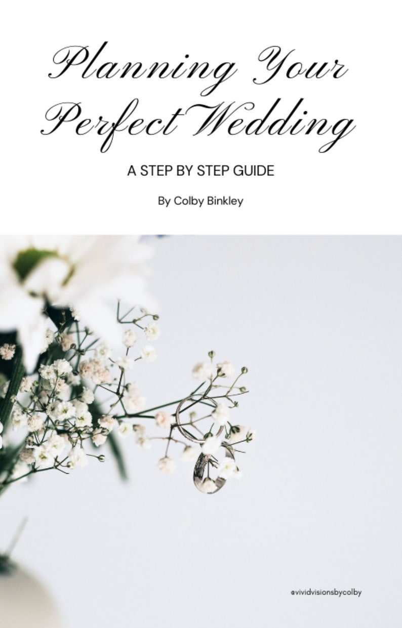 K&ouml;nnte beinhalten: Nahaufnahme von wei&szlig;en Schleierkrautbl&uuml;ten mit zwei silbernen Eheringen. Der Text "Planning Your Perfect Wedding" befindet sich oben im Bild. Der Text "A Step By Step Guide" befindet sich unter dem Titel. Der Text "By Colby Binkley" befindet sich unter dem Untertitel. Der Text "@vividvisionsbycolby" befindet sich unten im Bild.