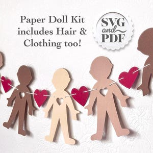 May include: A paper doll kit featuring cut-out figures in diverse skin tones, each with a heart-shaped cutout. Red heart accents are strung between the figures. The text "Paper Doll Kit includes Hair & Clothing too!" is visible.