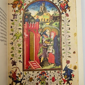May include: A detailed illustration from a medieval manuscript. The image features a central scene of two figures in religious garb, framed by an ornate border with floral and mythical creature motifs. A castle is visible in the background.