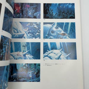 May include: A page from "The Art of Nausica&auml;" featuring several illustrations. The images depict scenes with blue and purple hues, showcasing fantastical creatures and landscapes. The text "THE ART OF NAUSICAA" is visible at the top.