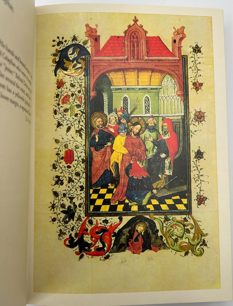 May include: A detailed illustration from a medieval manuscript. The artwork depicts a religious scene with figures in colorful robes, set within an ornate architectural frame. The page is bordered with floral and foliate designs, and the background is a parchment color.
