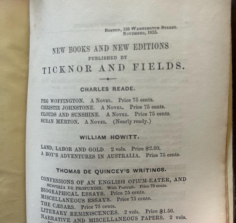 May include: A vintage book page from 1855, featuring a list of new books and editions published by Ticknor and Fields. The page includes titles by authors like Charles Reade and William Howitt, with prices listed in cents and dollars.