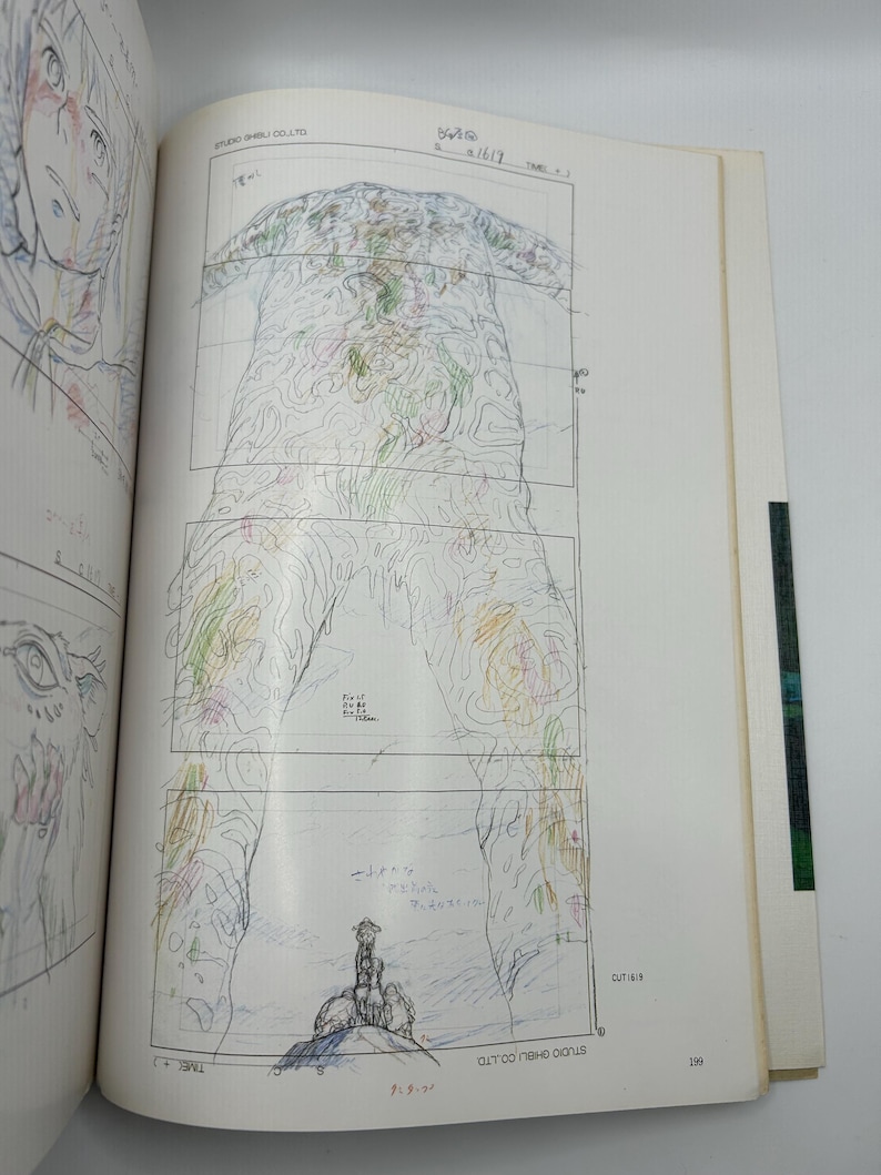 May include: A page from a Studio Ghibli production book featuring a pencil and colored pencil animation storyboard. The central image shows a large, textured, organic form with swirling lines, with a small figure standing at the base. Text includes Studio Ghibli Co., Ltd. and page number 199.