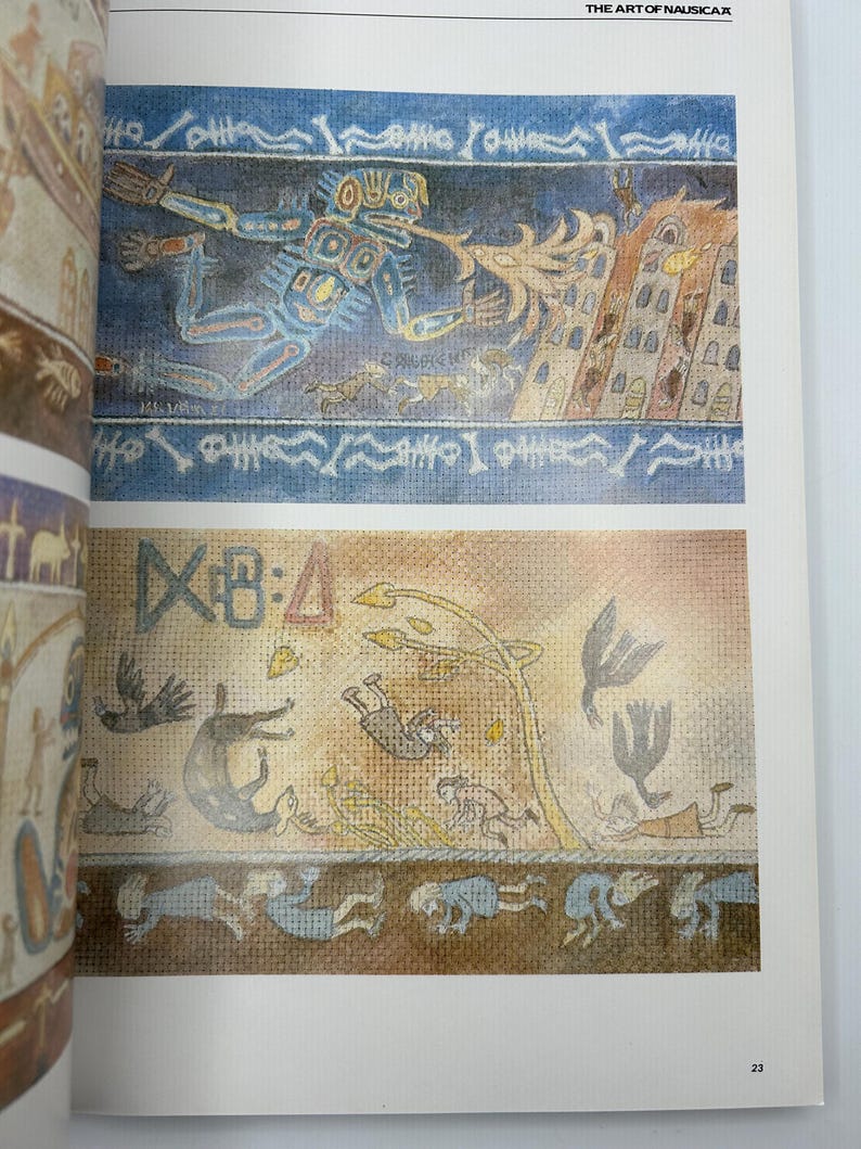 May include: Two-page spread from "The Art of Nausica&auml;" book. The top illustration depicts a blue figure with a flame, and a building. The bottom illustration shows figures, birds, and a tree. The page number is 23.