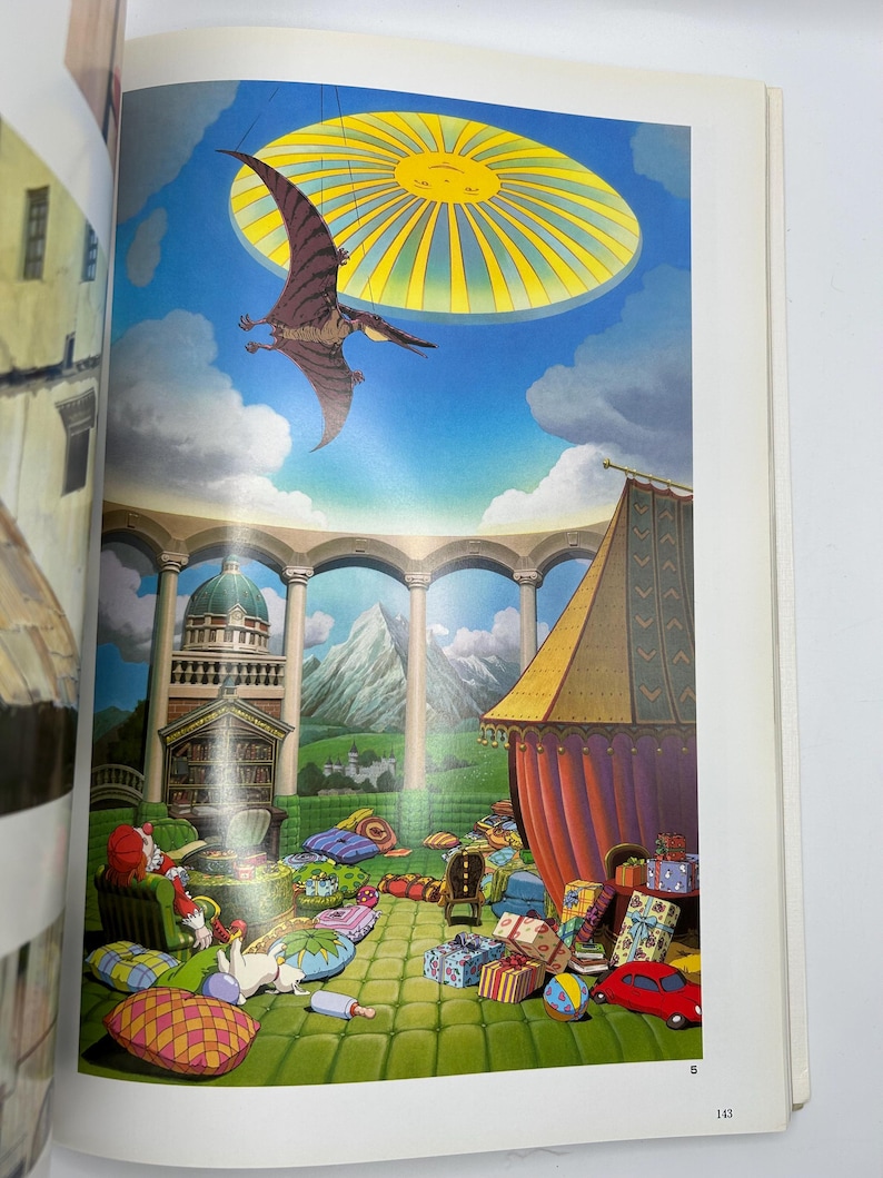 May include: A vibrant illustration from a book, featuring a pterodactyl soaring beneath a sun-like structure in a blue sky. The scene includes a building with columns, a tent, and colorful gifts, creating a whimsical atmosphere.