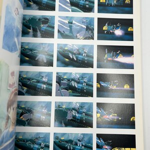 May include: A page from an animated film storyboard featuring multiple panels. The panels depict a large, dark green ship with white accents, set against a blue and dark background. Some panels show the ship in action with bright light effects.