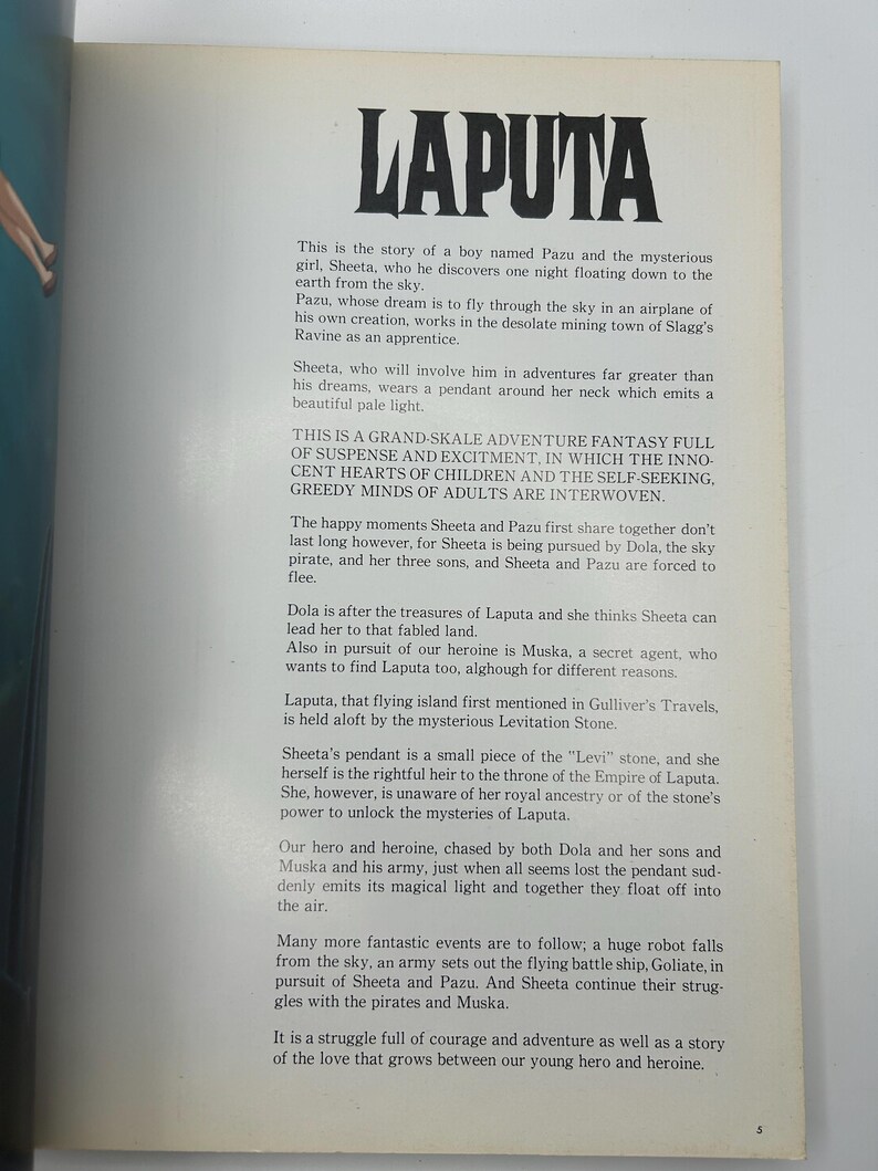 May include: A page from a book with the title "LAPUTA" in large, bold black letters. The text describes a fantasy adventure story about a boy and a girl, with themes of adventure, mystery, and a flying island.
