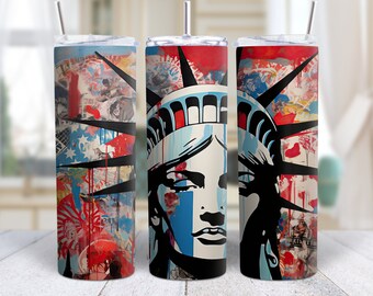 Puede incluir: Tres vasos de acero inoxidable con un diseño abstracto colorido que presenta la Estatua de la Libertad. El diseño incluye salpicaduras de pintura roja, blanca, azul y negra, y un collage de imágenes.
