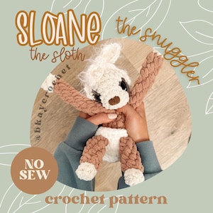 May include: A handmade crochet sloth toy named "Sloane the Snuggler." The plush animal features a white head, brown snout, and brown and white limbs. The text "NO SEW" and "crochet pattern" are also visible.