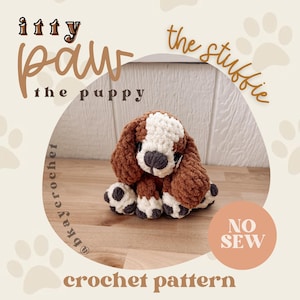 May include: A brown and white crocheted puppy plush toy with long ears, a dark gray nose, and paw pads. The image includes text reading: itty paw the stubbie the puppy, @bkaycrochet, NO SEW, and crochet pattern, set against a paw print background.
