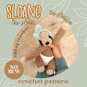 May include: A handmade crochet sloth toy in shades of brown, beige, and white, with a light blue bow. The sloth is wearing a white diaper. The image includes the text "SLOANE the sloth" and "crochet pattern".