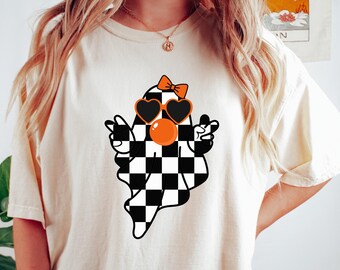 Cute Girly Ghost Blowing Bubble Comfort Shirt, Cute Ghost Fall Shirt, Retro Fall Shirt, Halloween Season Checkered Ghost Bow Shirt