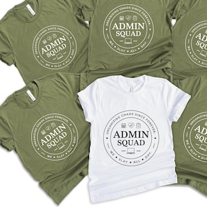 May include: Six green t-shirts with a white circle design that says "Organizing Chaos Since Forever Admin Squad We Slay All Day."  One white t-shirt with the same design.