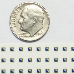 May include: A silver dime next to a strip of small, square stickers. Each sticker has a blue and white design within a gold border on a white background. The dime shows a profile of a man and the word "LIBERTY".
