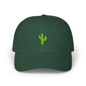 May include: A dark green baseball cap with a green cactus embroidered on the front.