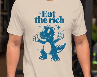 Camiseta con el dinosaurio Eat the Rich / Camiseta con gráficos retro vintage / Camiseta divertida con memes punk / Estética de sátira política / Estampado grunge de dinosaurios de los 90