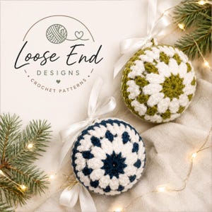 May include: Two spherical crochet ornaments with white satin ribbons. One ornament features a white and olive green granny square pattern, while the other displays a white and navy blue design. The logo Loose End Designs Crochet Patterns is visible.