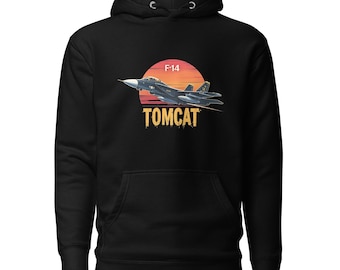 May include: Black hoodie with a graphic of an F-14 Tomcat fighter jet flying against a sunset. The design includes the text "F-14" and "TOMCAT". The hoodie has a drawstring hood and a front pocket. The design is printed on the front.