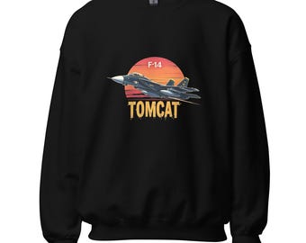 May include: Black sweatshirt featuring a graphic of an F-14 Tomcat fighter jet silhouetted against a sunset. The text "F-14" is above the jet, and "TOMCAT" is below it in a distressed font. The sweatshirt is a crew neck.