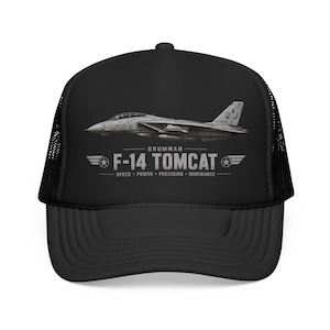 May include: Black trucker hat featuring a Grumman F-14 Tomcat fighter jet graphic. The design includes the text "F-14 TOMCAT" with the words "Speed, Power, Precision, Dominance" below. The hat has a mesh back and a curved brim.