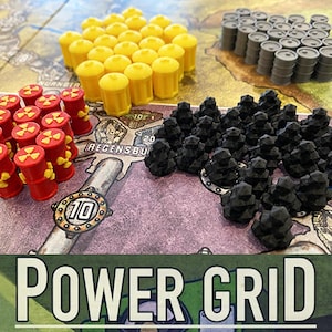 May include: A close-up of a game board with various coloured game pieces. The game pieces are made of plastic and are shaped like barrels. The game board is made of cardboard and has a map of Europe printed on it. The game is called "Power Grid".