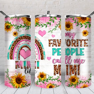 May include: A stainless steel tumbler with a pink and white background featuring a rainbow with a leopard print design, sunflowers, and the text "My favorite people call me Mimi".