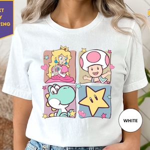 a woman wearing a white tshirt with mario and friends on it