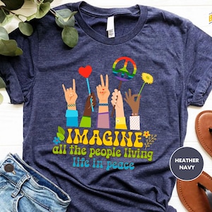 a t - shirt that says imagine all the people living life in peace