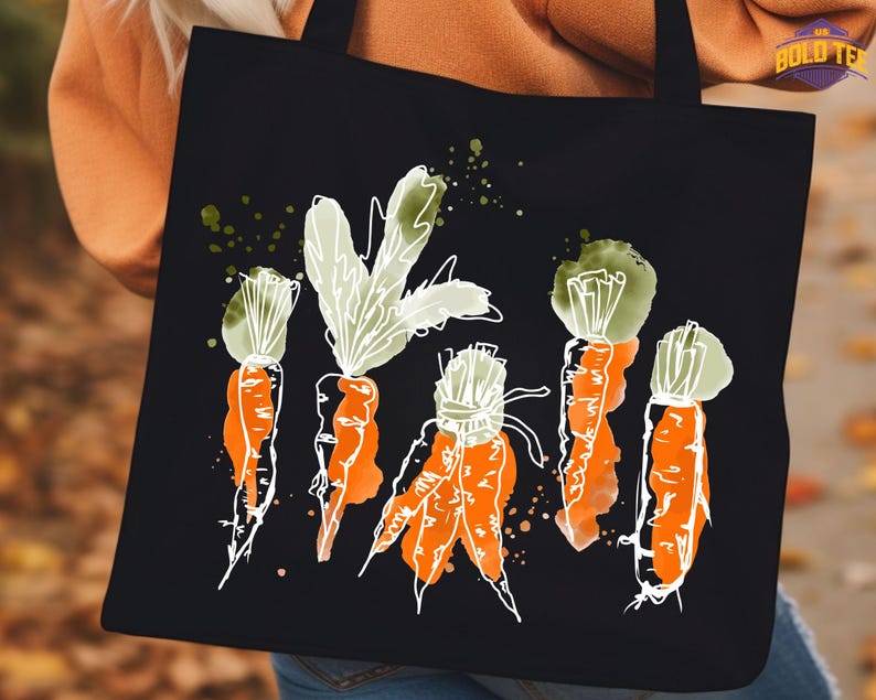 a woman holding a black bag with carrots painted on it