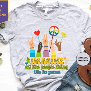 a t - shirt that says imagine all the people living life in peace