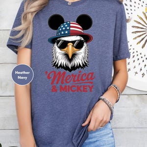 a woman wearing a mickey mouse t - shirt